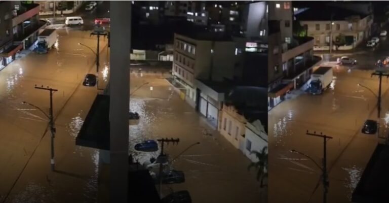 Ruas alagadas e carros submersos após fortes chuvas em Juiz de Fora, Minas Gerais.